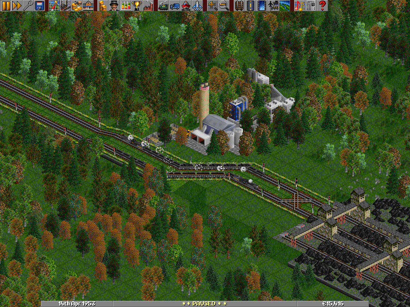 I explored the map and found excellent opportunity to revive my coal services - three coal mines relatively close to each other with total of 400 tons/month production. Two small feeder trains were dispatched to feed the coal terminal, which is seen here at the right part of the screen. The feeders use the left two platforms, while the mastodons we see at the center of the screen go to the right ones. There's one more coal monster around here...