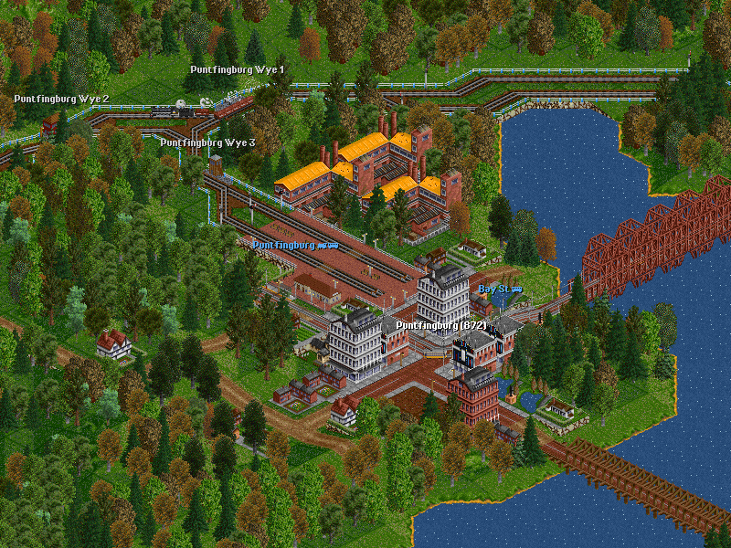 Here we are in Puntfingburg with a loaded iron ore train en route from Tanville Mines to Tatfingbourne Steel Mill. Puntfingbourne is the terminal of all passenger trains on the Mountain Division as the track going eastward is used by freight trains only.