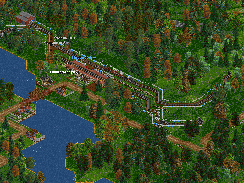 Findborough is halfway between the two terminals of the Gadham Division. Here the track to the mine branches off from the main line to Gadham. Luckily, in this pic we can spot both trains of the Division: the coal train leaded by Mikado #150 going up to the mine and the passenger train with Pacific #336 at the head (and just one passenger in two coaches!). By the way, now I see that the county road to Gadham has been remained interrupted after construction works of the parallel railroad. I must remember to repair it!