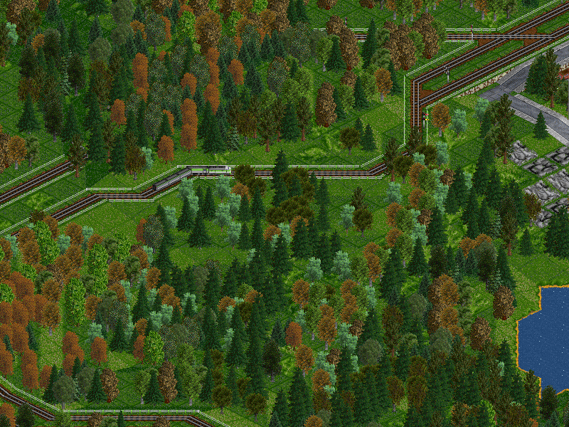Shot of an EMD-E Unit along the hillside track overlooking a lake.