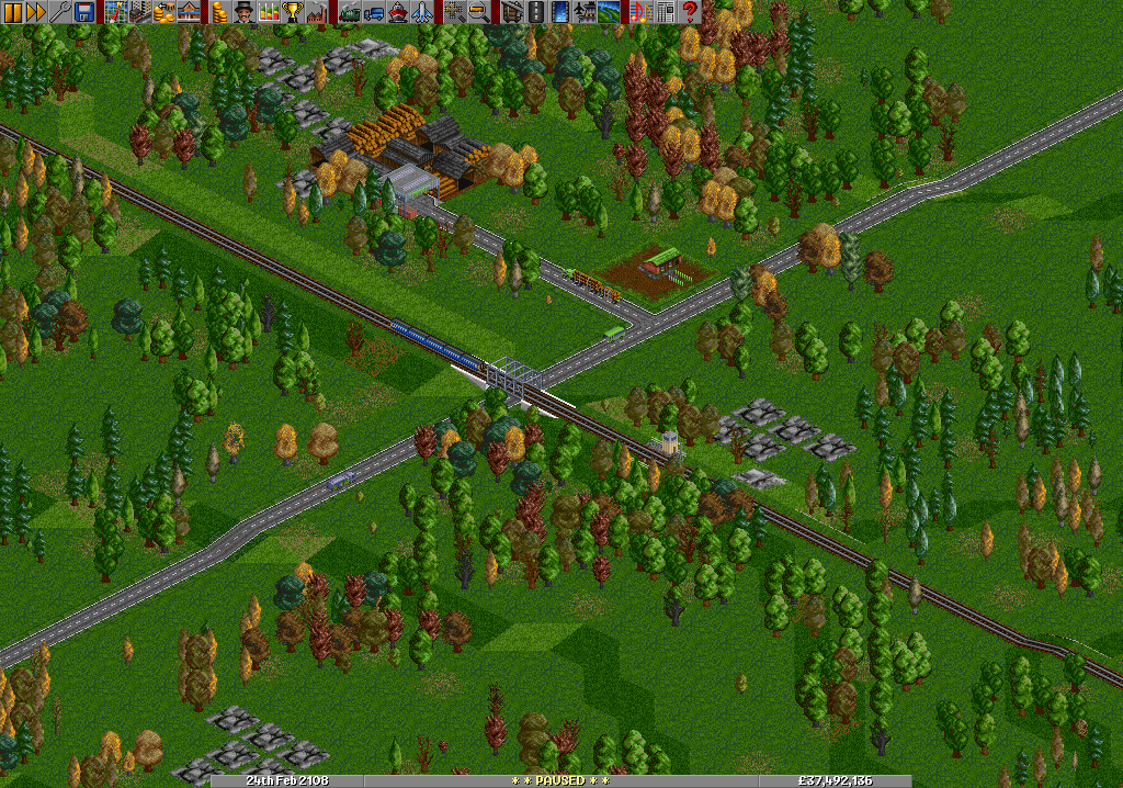 A Lumber mill, a train and a road.