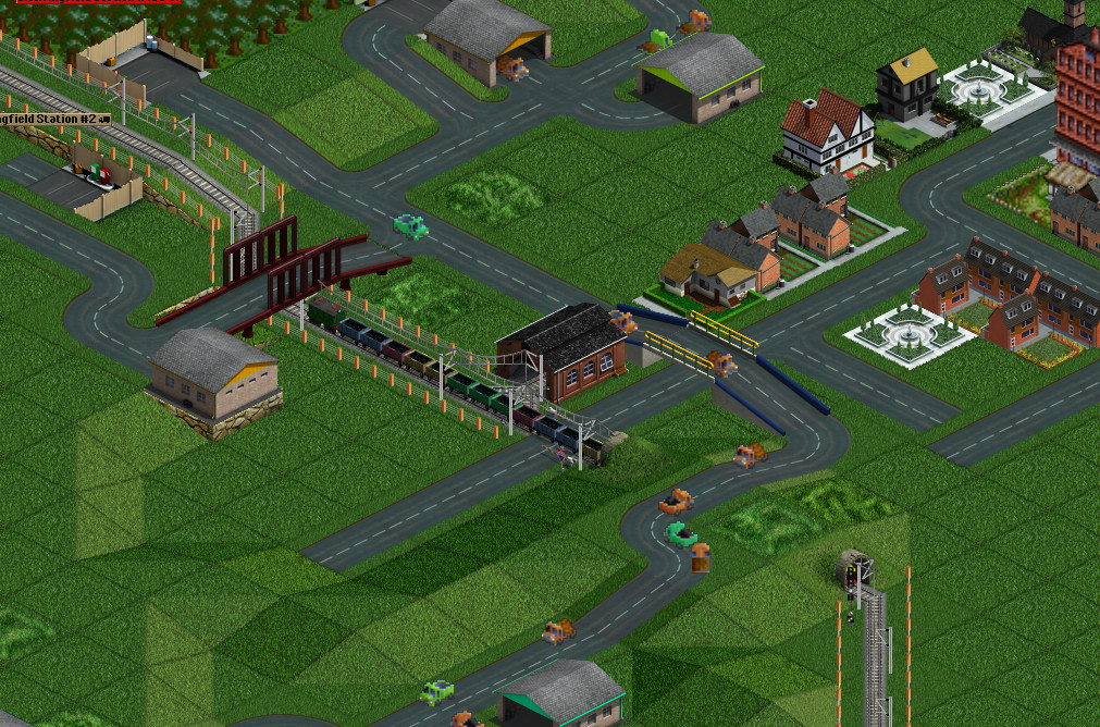 Road crossing. A AI player build a station but It is not connected with the road network. The pavement of the new GRF park is maybe too shiny.