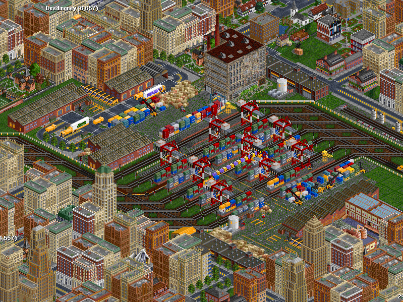 If you remember Deadingney Woods' industrial area, it had started to become quite crowded, with five companies all operating their own stations. It only got worse over time, gridlock everywhere! <br /><br />After a huge fire in the 2240, the GSG Regional Authority put their foot down, and their pocketbooks followed. A large intermodal station was built to allow smooth roll-in/roll-out transition of trains, and plenty of overhead cranes to load and unload containers. Nary a bit of gridlock now!