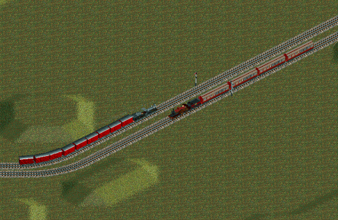 An Edwardian express of the Midland Railway passes a goods train between Leicester and Kettering.