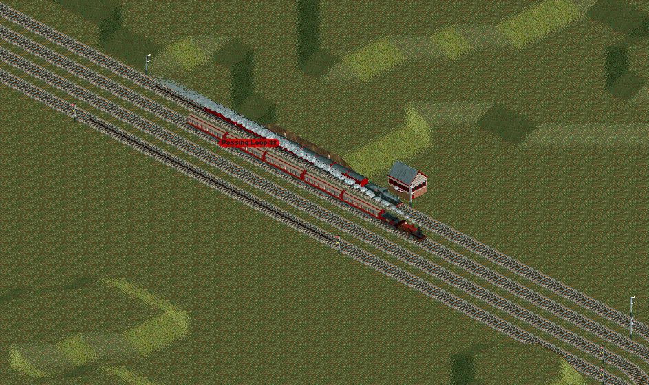 On the line between Leicester and Kettering, a goods trains is held in a passing loop to allow an express to pass.