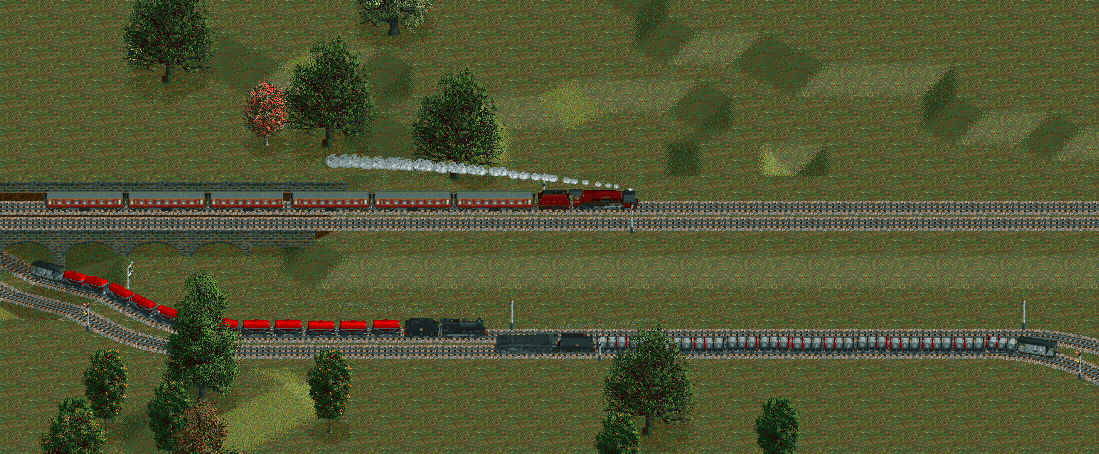 Three trains passing at the same location as the previous shot.