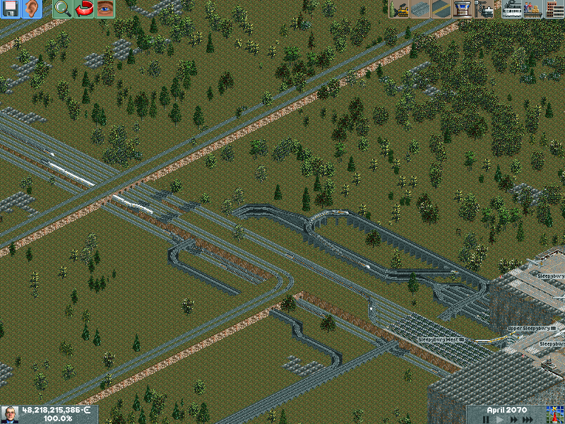 Other angle of the Colonists Academy. Lot's of passenger trains provide the station, while the colonists trains go at full speed to the Space Port. The Goods line passes near by the academy.