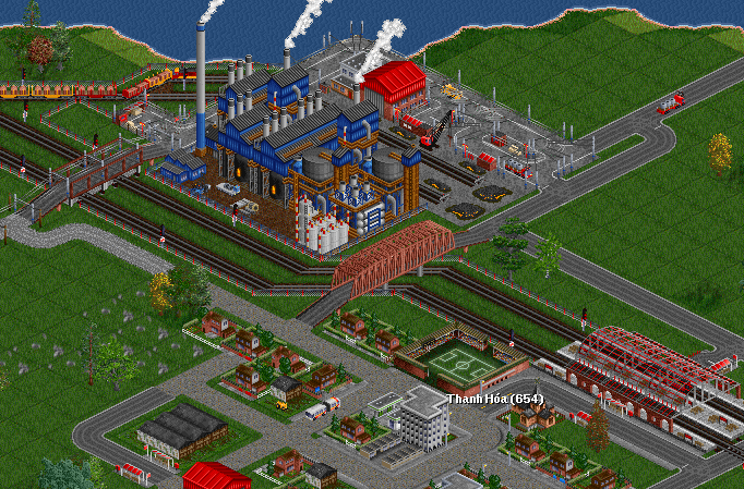 A trainload of iron gets delivered to the basic oxygen furnace, along with short rakes of quicklime. Two open trolley-trucks carry off the waiting slag, and bi-mode flatbed trucks take the finished steel to be turned into various products. A bendy bus serves residents of the mill town.