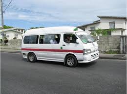 This is a Toyota hiace 100 Series in the ZR Livery White and Marun stripes
