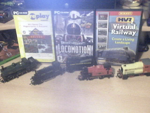 Queen mary (2nd from left) and my other little old trains. just showing off 3 very good games aswell there :P :wink: