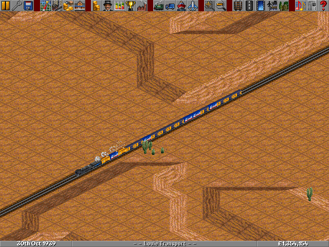 An Ac6 Hauling reefers full of fruit across a barren desert intersected by a few cactus