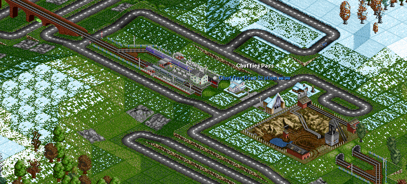A &quot;Rhinegold&quot; Express rushes past a local train stopped at the quaint little station up at Chuffies Pass. Being summer time, the snow isn't as heavy as in winter time.