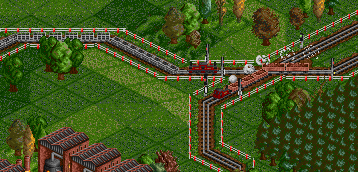 On a nearby mineral branch, Single Fairlie No. 2 heads a loaded iron ore train while a Double Fairlie on slate duties awaits a clear signal.