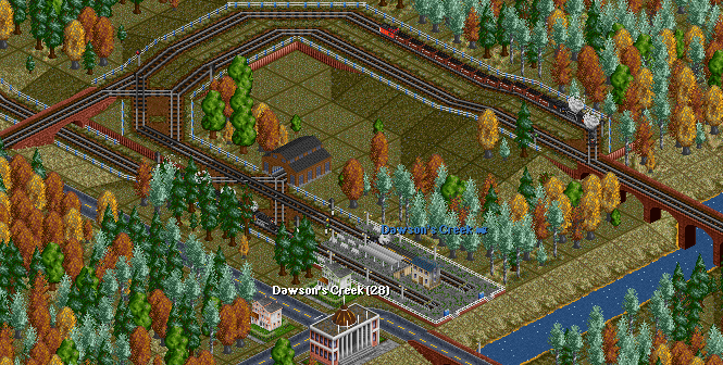 As the coal train slowly grinds up the hill, the passenger train sets off from the station.<br />On the second platform, an armoured train arrives with gold from the mines.