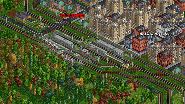 The train rumbles through Satfinghall City. A stopper for the older route is seen in platform 2.