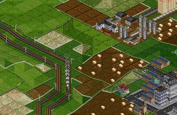 The train continues to decend. Two agricultural trains can be seen in the farm station.
