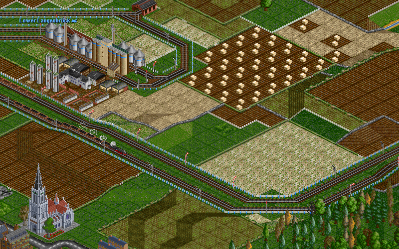 After passing an empty coal train, its gondolas still seen in the screenshot, the train leaves the farm junction behind and goes up a gentle incline.