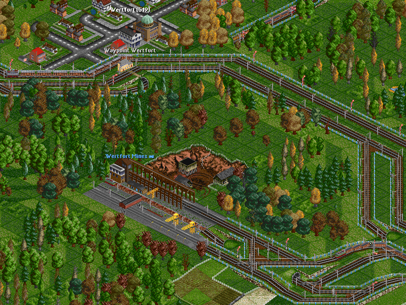 This iron ore mine had around 200 tonnes/month production, so I wanted lots of trains on it, but felt a ro-ro station would be too messy. Around the mine can be seen two farm trains. The whole area is electrified since I can afford electric trains now.