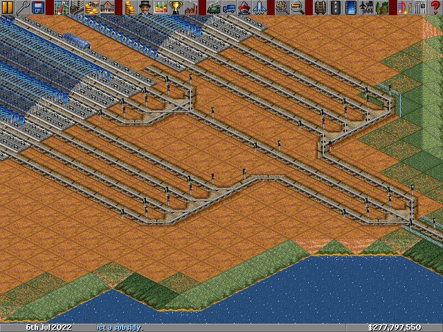 The trains enter in the bottom right corner, then they choose one of three paths into the station.  From there, they choose one of the four available platforms or they wait for one to be freed up.  In the tests that I ran, it seemed to work.
