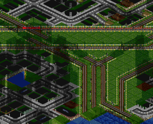 This is as it is now, a source of nightmares, and no ability to expand it (unless I destroy parts of the neighboring towns - which I'm a bit reluctant to do). Now, a very long bridge might seem to help, but only gets me a different can of worms.