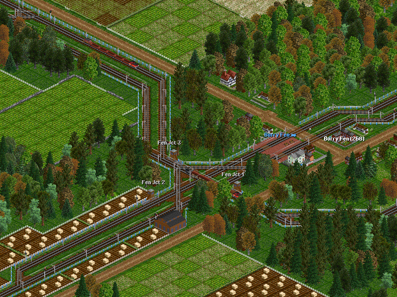 Yes, we are lucky! First the 0020 steeplecab has passed over the junction with an empty train heading to the steel mill. Now the diamond is hit by the 0010 with another empty destined to Burry Fen Woods siding (farm).